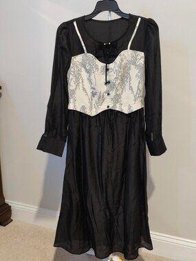 NWT Black and white dress with lace up front and button down sleeves